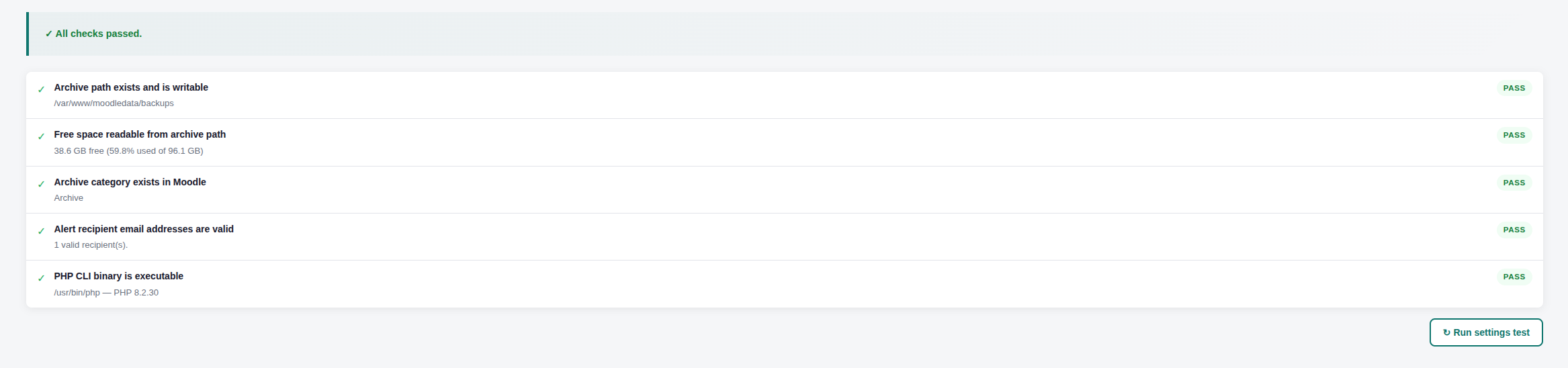 A list of five passed checks with green "PASS" labels on a software interface